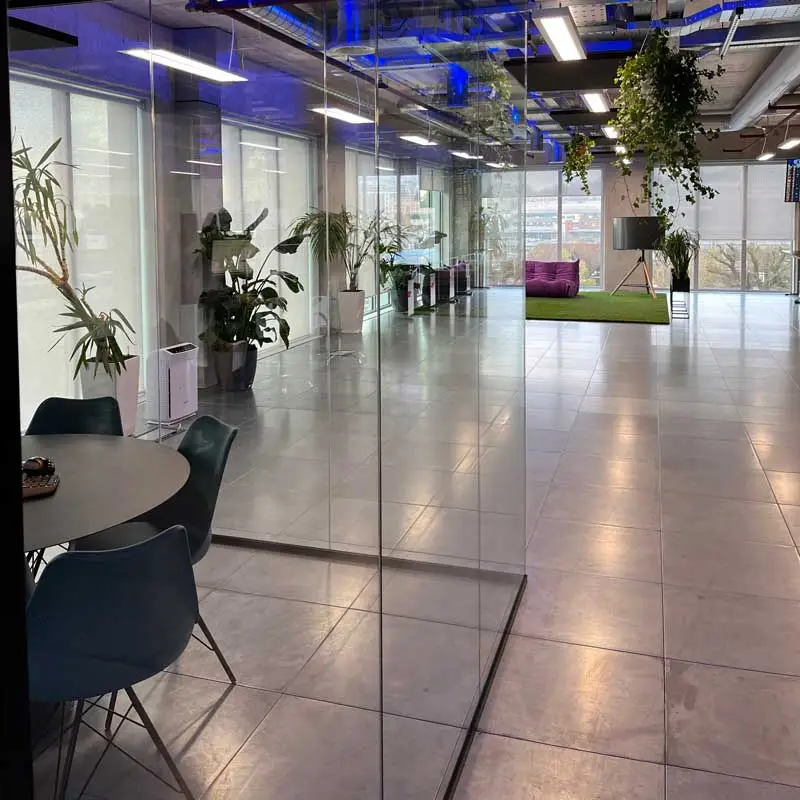 Photo showing glass office partitioning allowing light through
